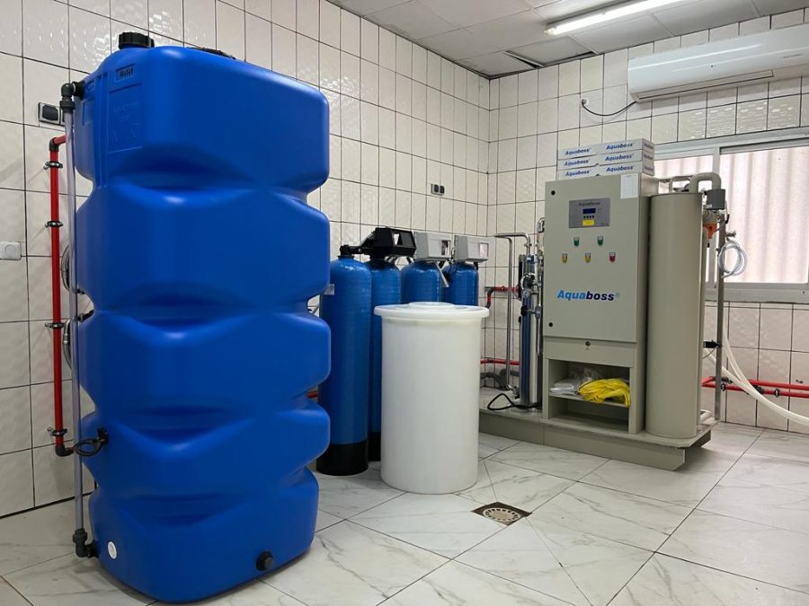 Aquaboss reverse osmosis water treatment system with blue storage and pretreatment tanks at the Bafoussam hemodialysis centre